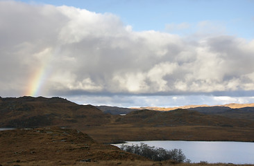 Image showing scottish scenery with rainbow and dramatic sky