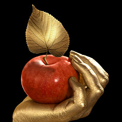 Image showing golden hand and apple