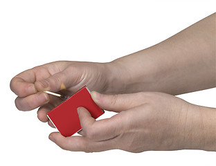 Image showing hands while starting a fire