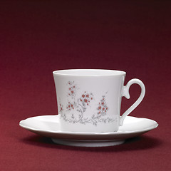 Image showing tea cup in red back