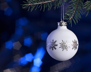 Image showing white Christmas bauble in dark blue back