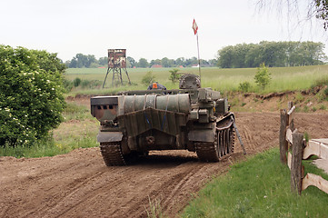 Image showing offroad scenery with driving tank