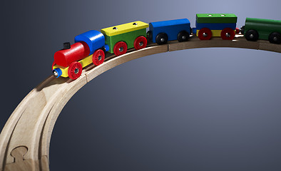 Image showing colorful wooden toy train on tracks