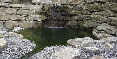 Image showing stone wall and pond detail