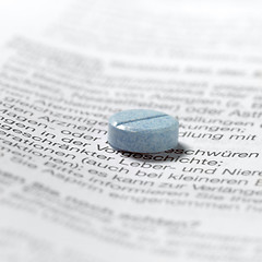 Image showing blue pills on package insert