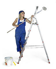 Image showing painting girl on a ladder