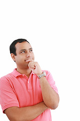 Image showing handsome hispanic man looking upwards at copyspace thinking 