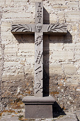 Image showing Stone cross near wall