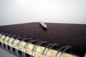 Image showing pen on leather covered notebook