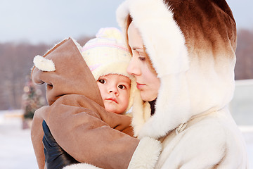 Image showing Mother with baby in winter