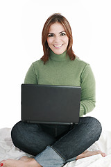 Image showing Woman student sitting with laptop isolated on white background