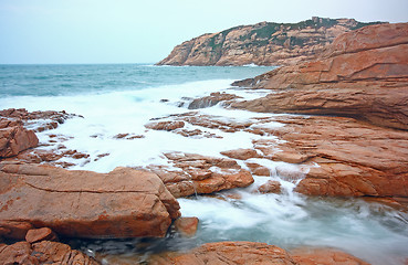 Image showing rocky sea coast and blurred water in shek o,hong kong 