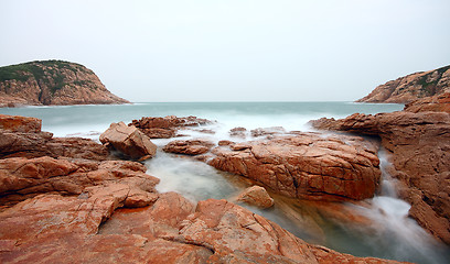 Image showing rocky sea coast and blurred water in shek o,hong kong 