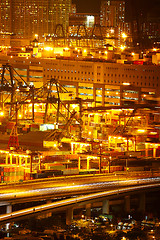 Image showing Port warehouse with cargoes and containers at night