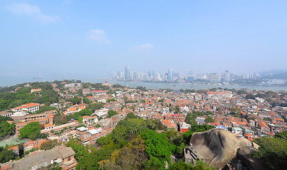 Image showing Aerial image of a modern city by a river 