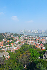 Image showing Aerial image of a modern city by a river 