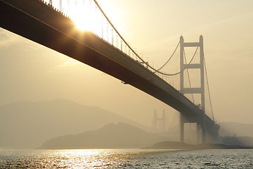 Image showing long bridge in sunset hour