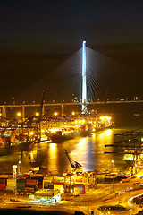 Image showing Port warehouse with cargoes and containers at night