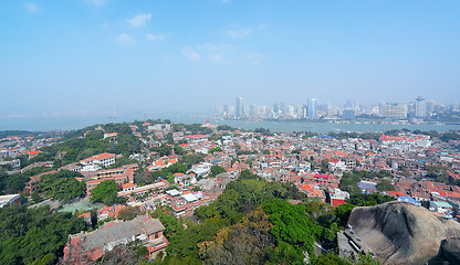 Image showing Aerial image of a modern city by a river 