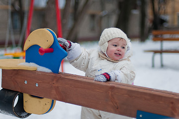 Image showing Little girl near the swing