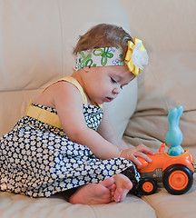 Image showing Little girl plays with her toy