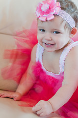 Image showing Little smiling girl in the pink dress