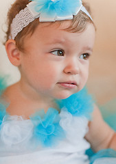 Image showing Little thoughtful girl in blue dress