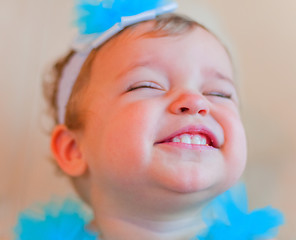 Image showing Little smiling girl with closed eyes