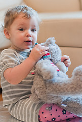 Image showing Little girl with her teddy bear