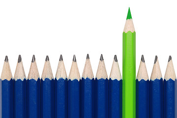 Image showing Green crayon standing out from the crowd