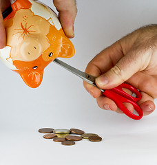 Image showing getting money out of piggy bank