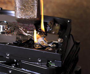 Image showing destroying a hard disk with huge hammer