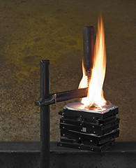 Image showing flames on stack of pressed hard drives