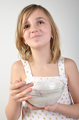 Image showing happy child with a bowl of milk porridge