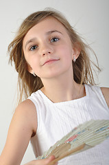 Image showing  girl with a fan