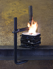 Image showing burning vise and hard disks