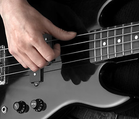 Image showing hand on bass guitar