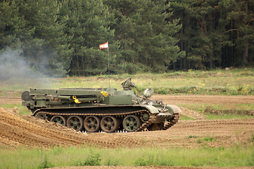 Image showing offroad scenery with driving tank