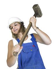 Image showing cute girl while hammering