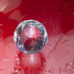 Image showing diamond sphere in red wet ambiance