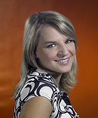 Image showing friendly young girl portrait in brown back