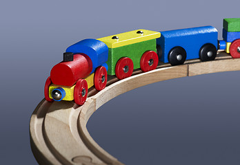 Image showing colorful wooden toy train on tracks