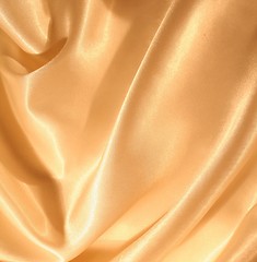 Image showing Smooth elegant golden silk as background