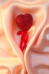 Image showing Red heart on elegant pink silk for St Valentine's day background