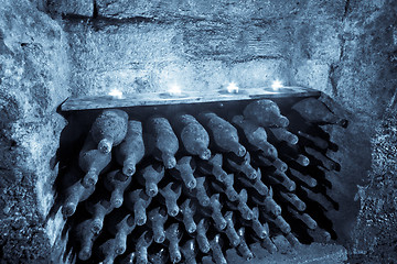 Image showing wine bottles with candles