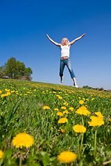 Image showing happy young woman on meadow