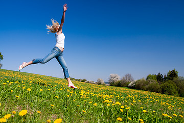 Image showing happy young woman on meadow