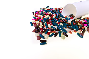Image showing pills spilling out of container 