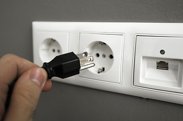 Image showing inserting plug