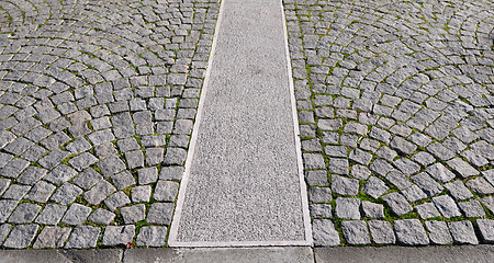 Image showing Old grey pavement in a pattern in an old medieval european town.